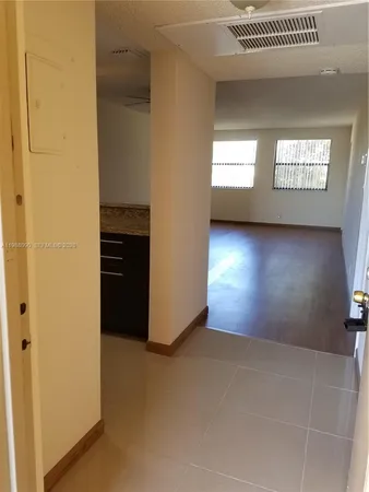 a view of an empty room and window