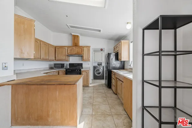 a utility room with sink dryer and washer