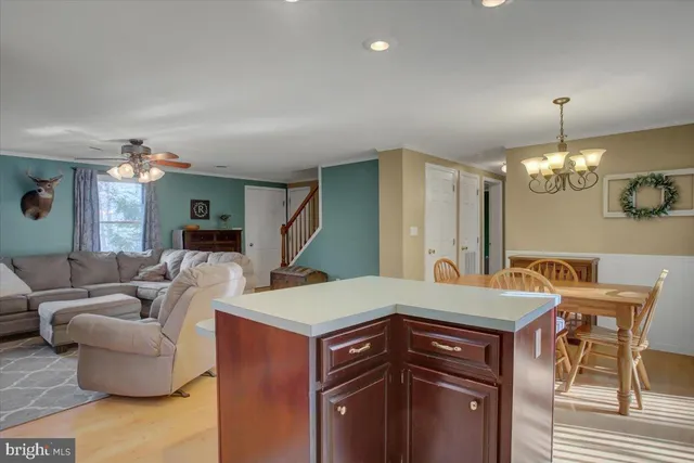 a view of a livingroom with furniture and chandelier