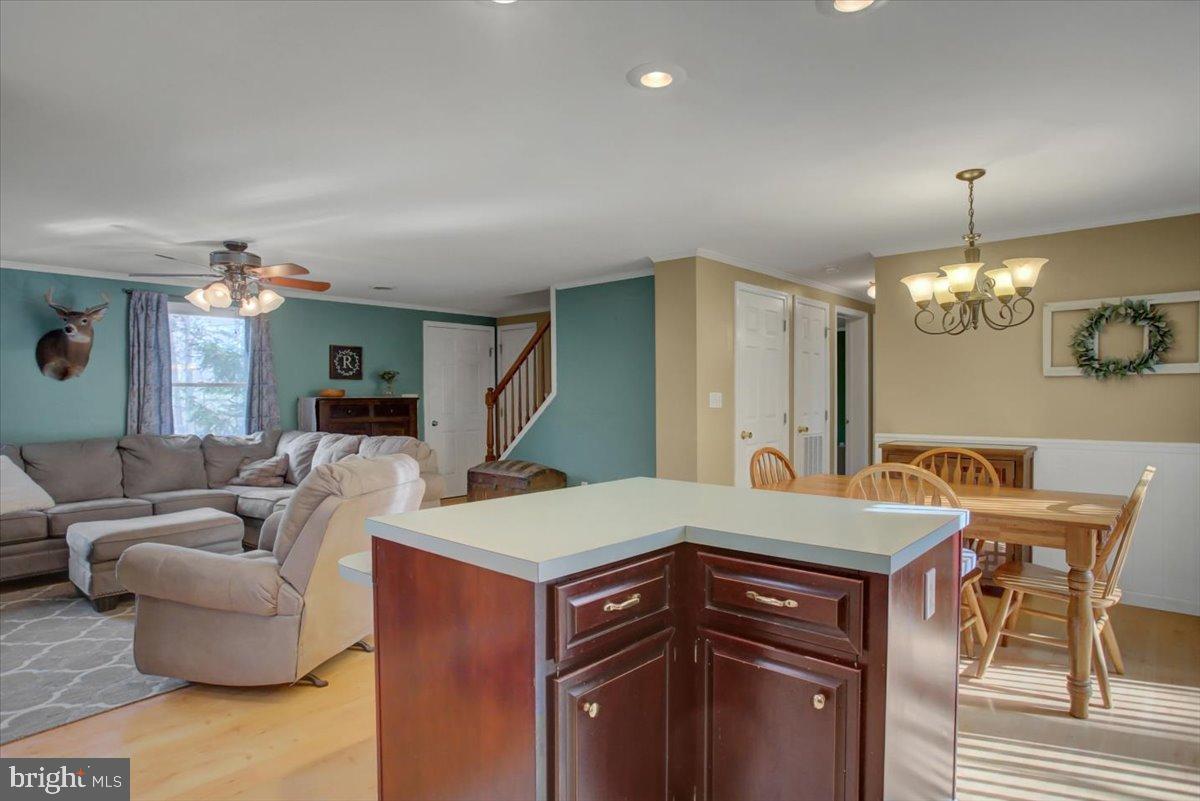 10744 Coral Ridge Road Fayetteville, PA 17222 - Photo 13 of 40 a view of a livingroom with furniture and chandelier