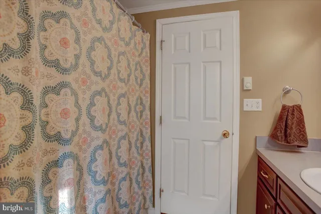 a view of a bathroom from a hallway