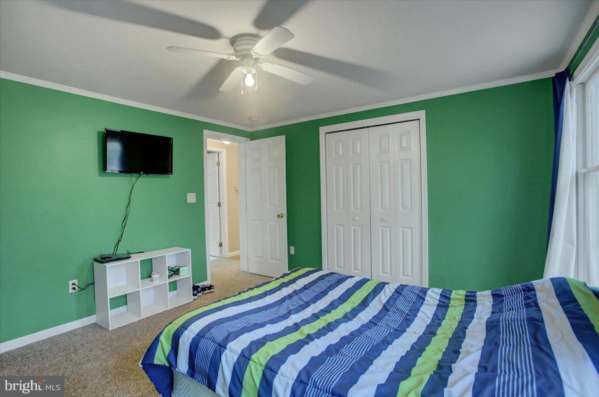 10744 Coral Ridge Road Fayetteville, PA 17222 - Photo 19 of 40 a bedroom with a bed and a television