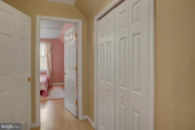 a view of a bathroom from a hallway