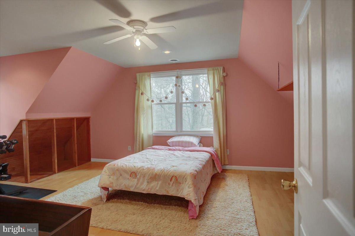 10744 Coral Ridge Road Fayetteville, PA 17222 - Photo 26 of 40 a bedroom with a bed and a large window