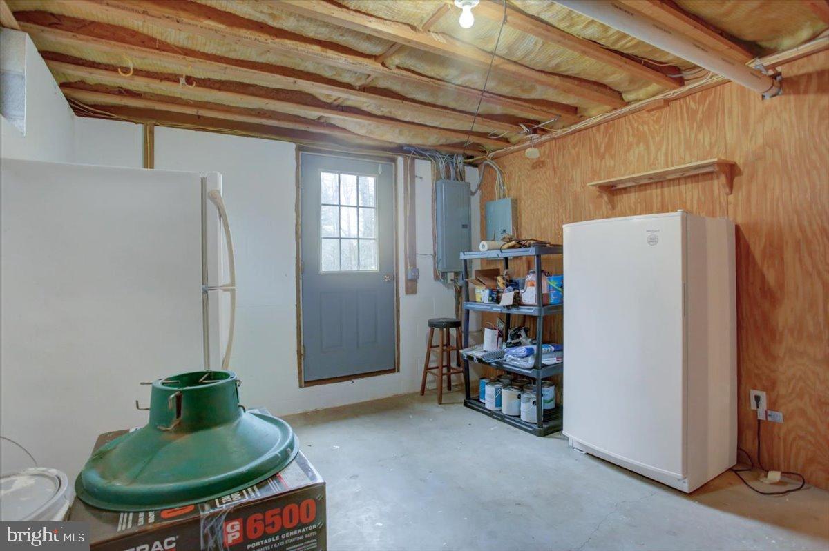 10744 Coral Ridge Road Fayetteville, PA 17222 - Photo 31 of 40 a living room with closet and a couch