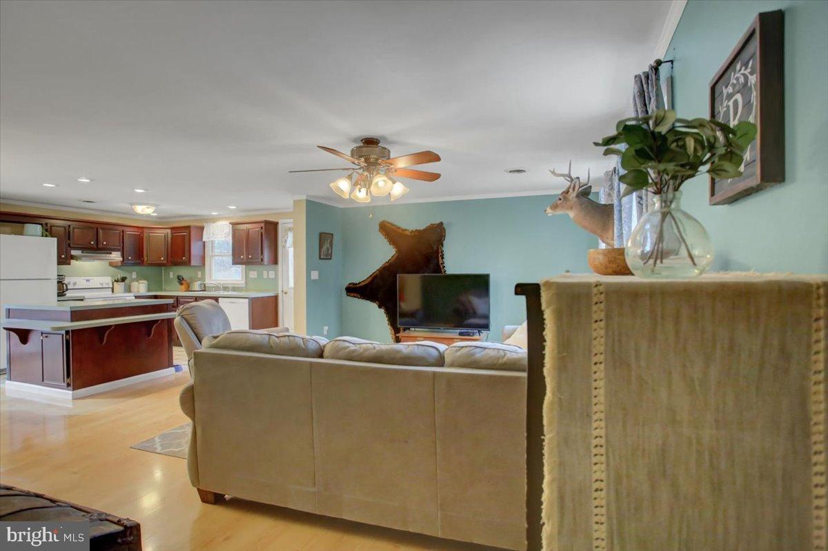 10744 Coral Ridge Road Fayetteville, PA 17222 - Photo 7 of 40 a living room with furniture and a chandelier