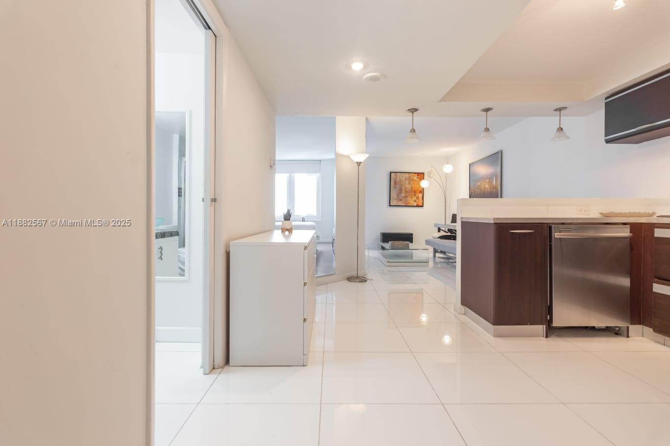 2301 Collins Avenue, Unit 1023 Miami Beach, FL 33139 - Photo 8 of 15 a view of a kitchen with a sink