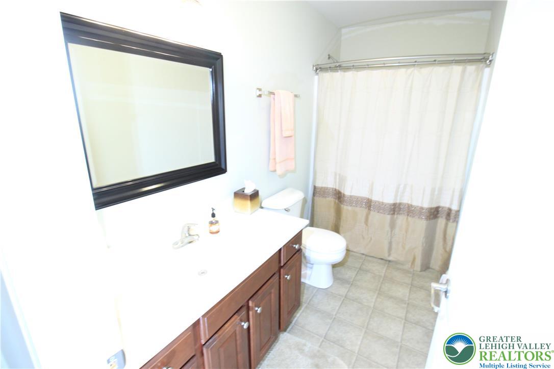 472 Bauer Road Bath, PA 18014 - Photo 14 of 47 a bathroom with a sink a toilet and shower