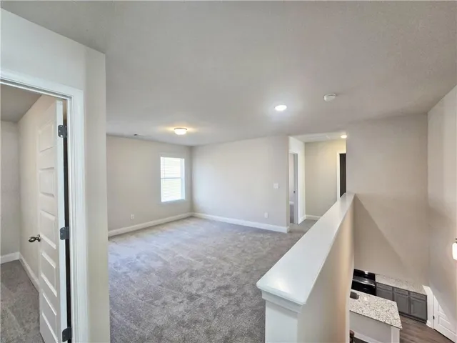 a view of livingroom and hardwood floor