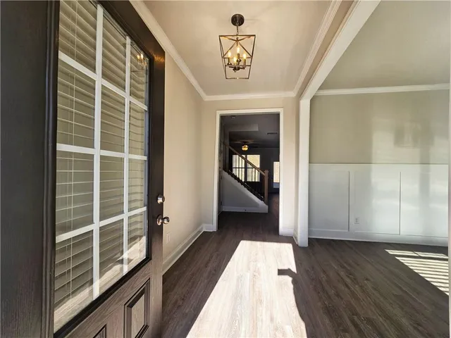 a view of a balcony with wooden floor and furniture