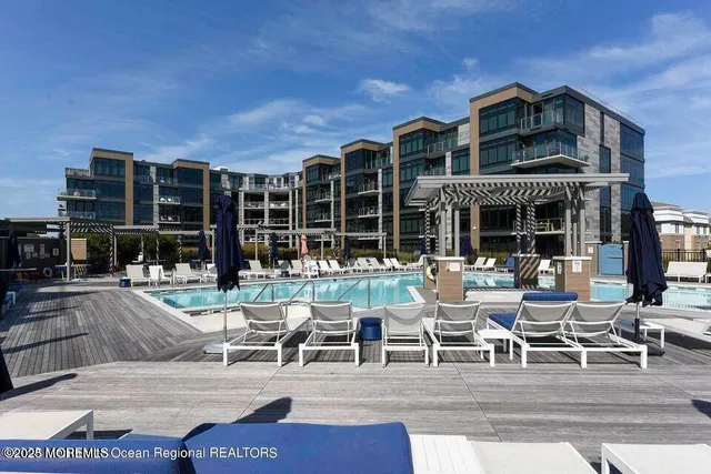 a front view of a building with outdoor seating