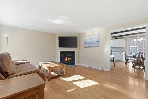 a bedroom with furniture and a fireplace