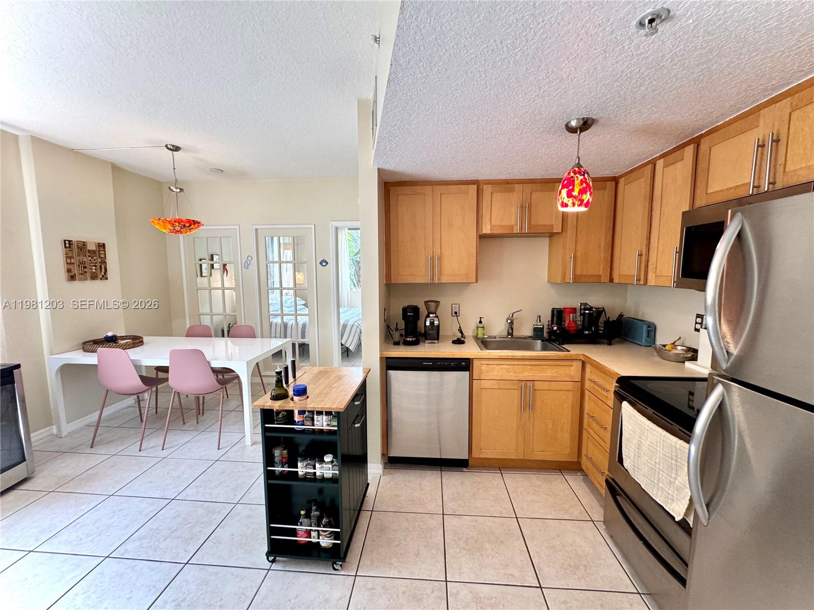 2630 Southwest 28th Street, Unit 1 Miami, FL 33133 - Photo 11 of 33 Open concept with the convenience of SS appliances