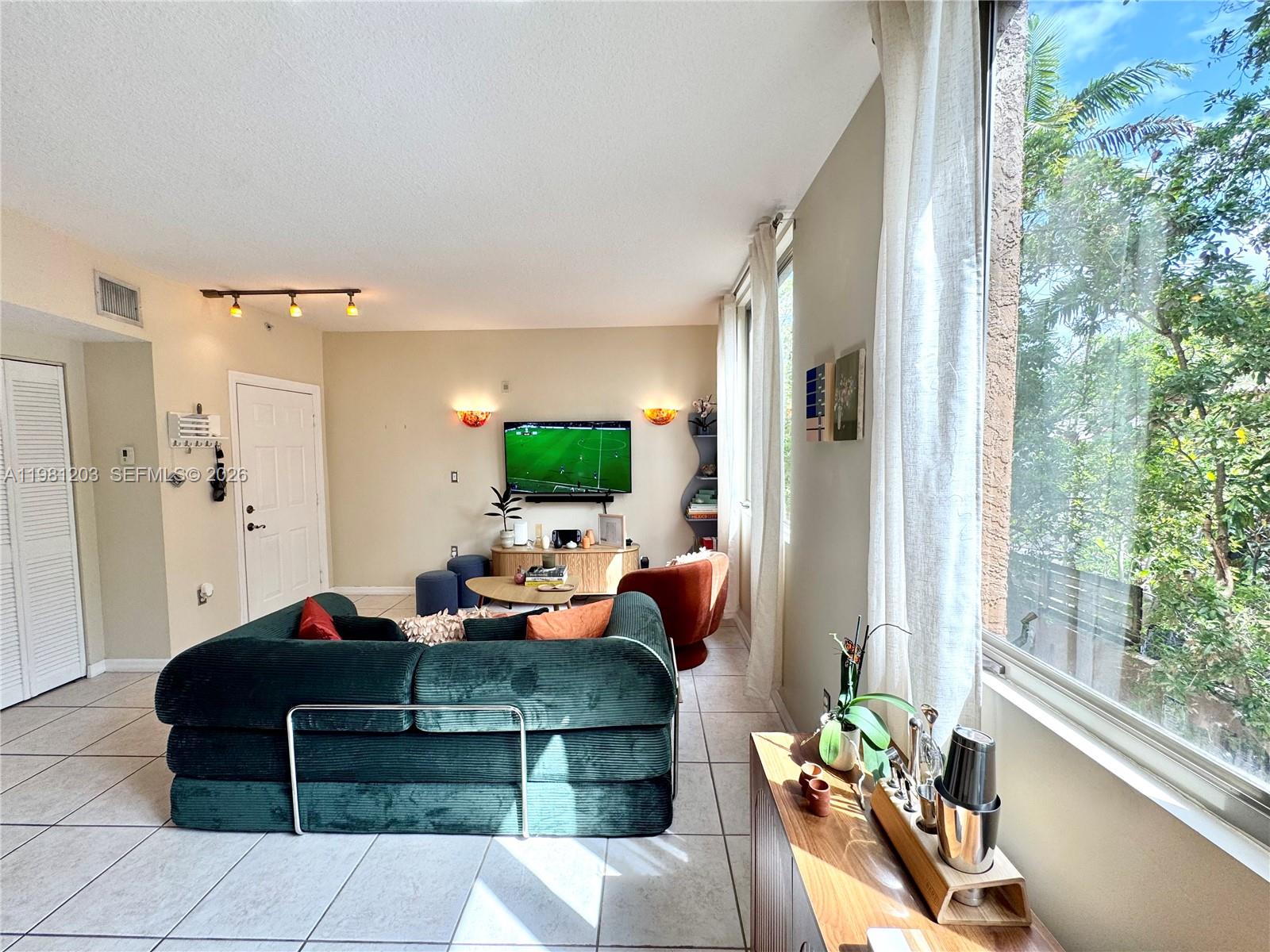 2630 Southwest 28th Street, Unit 1 Miami, FL 33133 - Photo 14 of 33 Abundant natural light streams through large formatted impact windows all day.