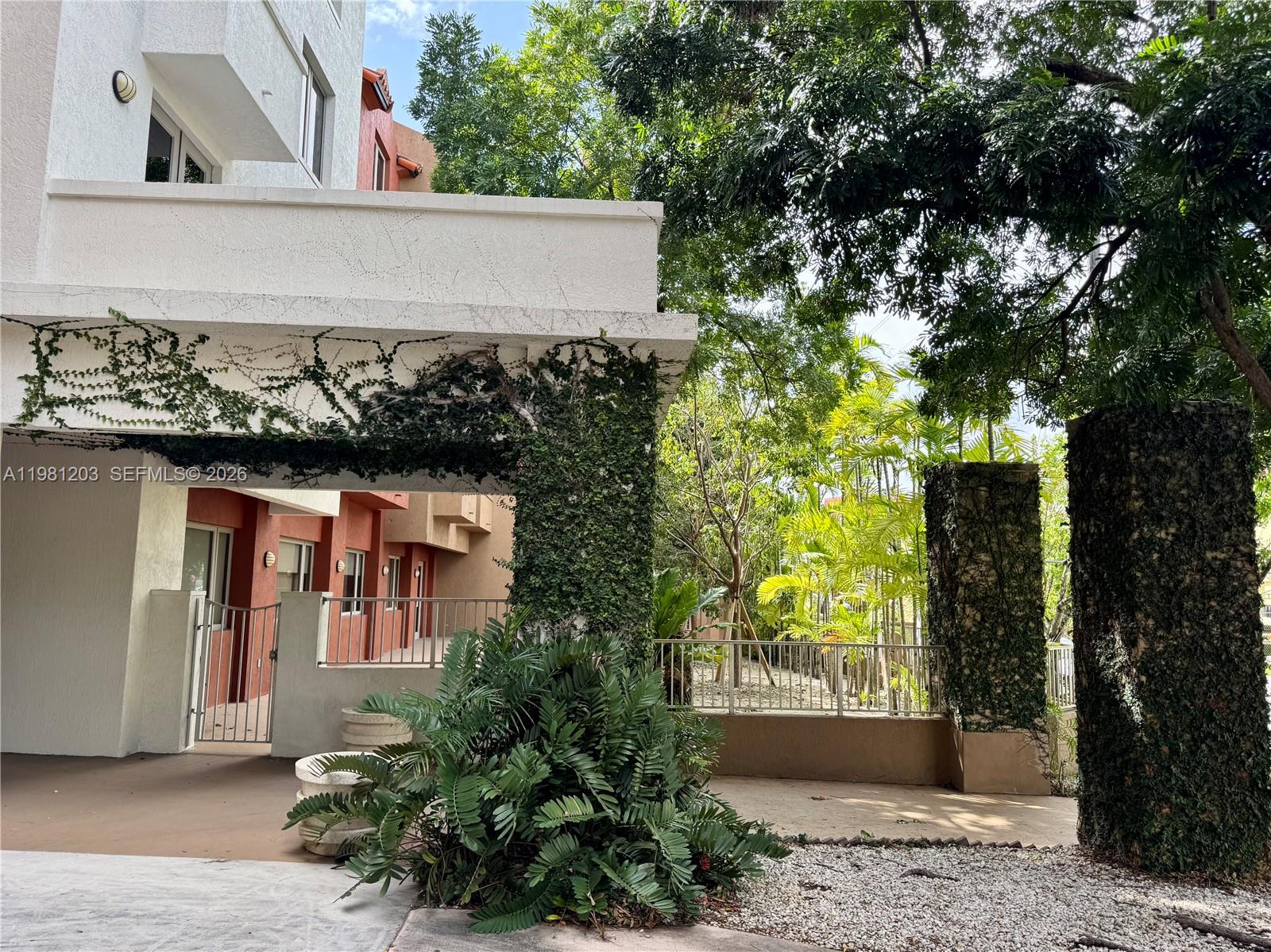 2630 Southwest 28th Street, Unit 1 Miami, FL 33133 - Photo 21 of 33 Charming and alluring front, side and rear elevations of this unique boutique building set amidst lush tropical flora and fauna.