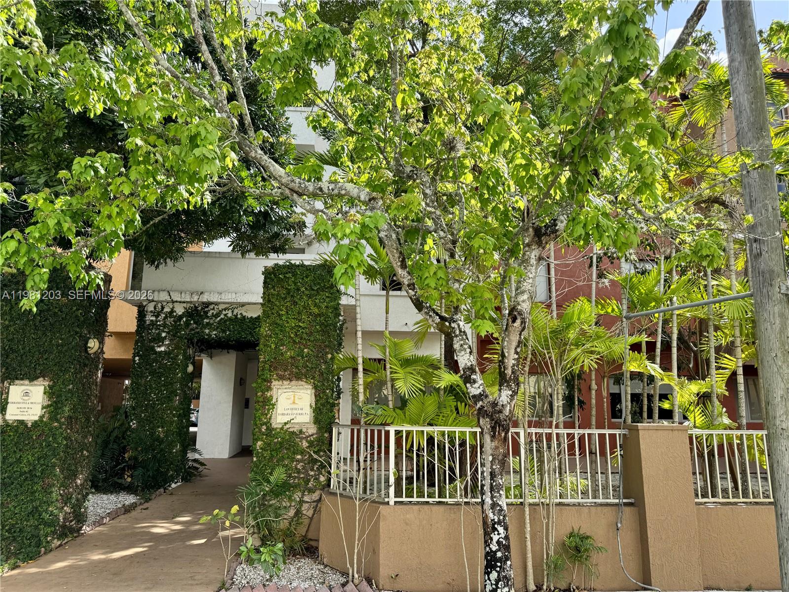 2630 Southwest 28th Street, Unit 1 Miami, FL 33133 - Photo 22 of 33 Abundance of tree lined streets and flora fauna for which the village of Historic Coconut Grove is known.