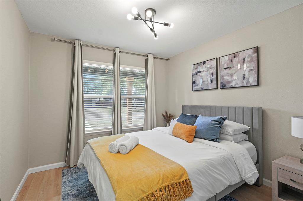 513 East Tyler Street Richardson, TX 75081 - Photo 18 of 18 a bedroom with a bed and a window