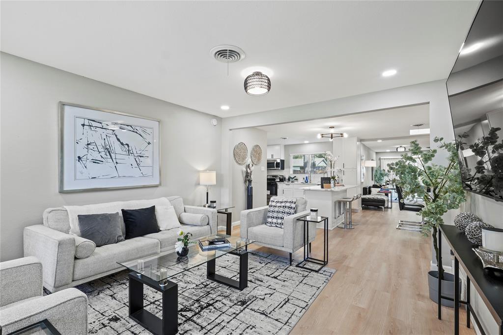 513 East Tyler Street Richardson, TX 75081 - Photo 4 of 18 a living room with furniture and a large window
