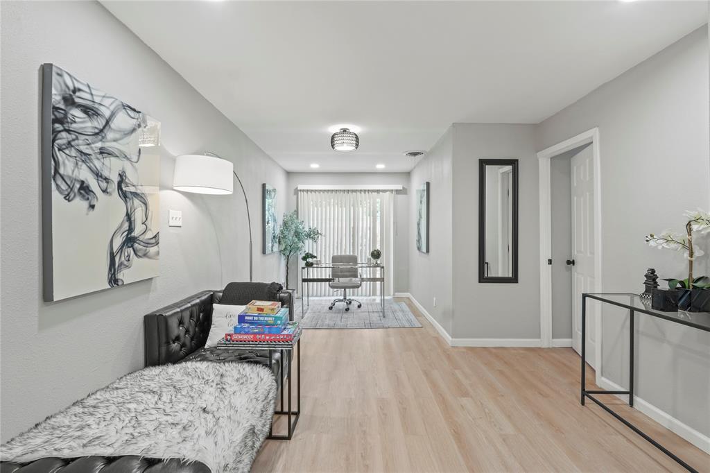 513 East Tyler Street Richardson, TX 75081 - Photo 10 of 18 a living room with furniture and wooden floor