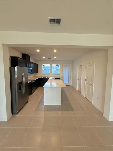 a large space with kitchen view
