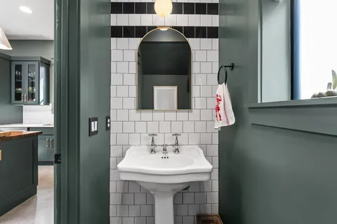 a bathroom with a sink and a mirror
