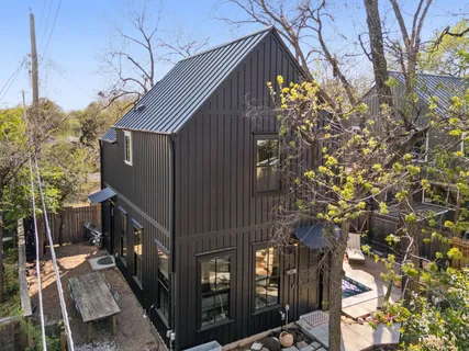 a view of a house with a tree