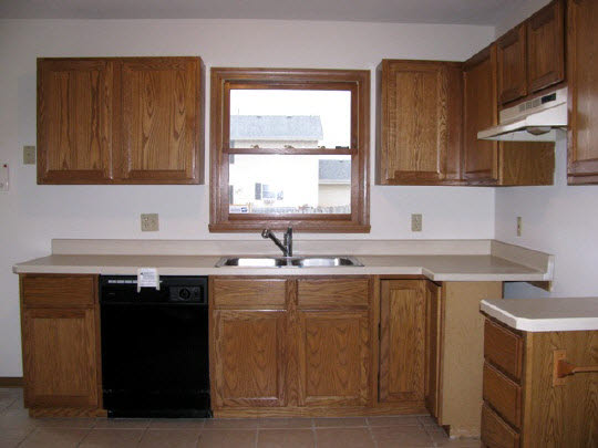 5376 Rockingham Drive Loves Park, IL 61111 - Photo 4 of 11 a kitchen with a sink a stove and a microwave