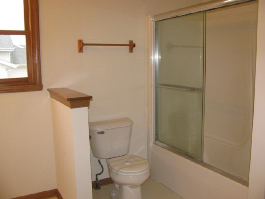 5376 Rockingham Drive Loves Park, IL 61111 - Photo 9 of 11 a white toilet sitting next to a shower