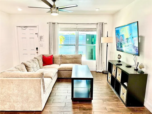 a living room with furniture and a table