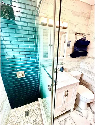 a view of a balcony with chair and table