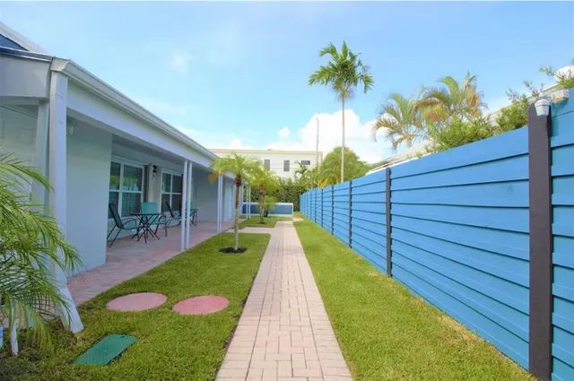 a view of house with swimming pool outdoor seating