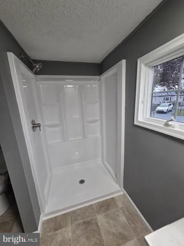 a view of a hallway to a livingroom and a hallway