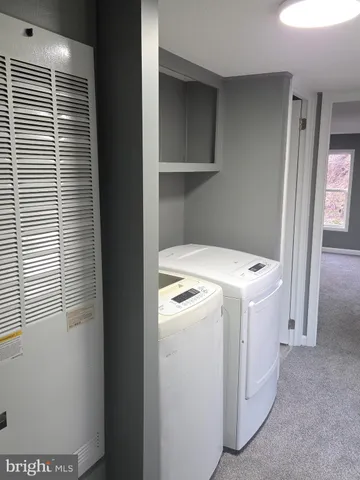 a view of a room that has a large window