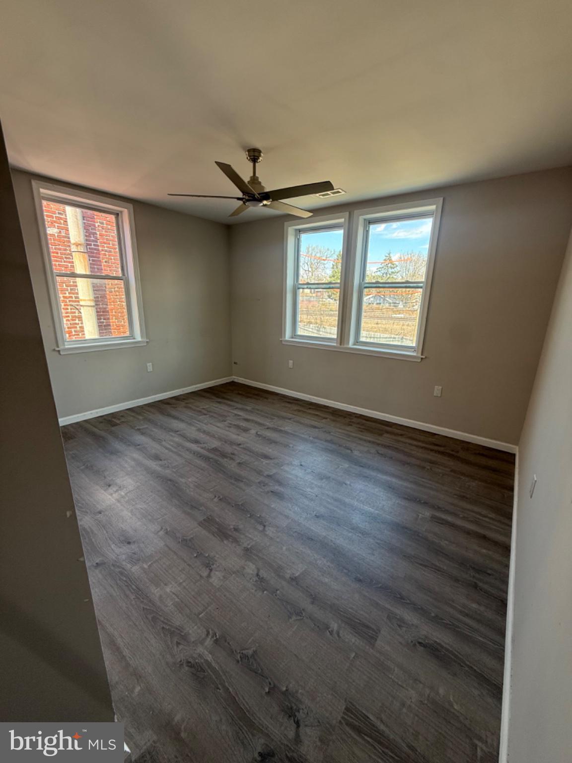 2013 North 63rd Street Philadelphia, PA 19151 - Photo 6 of 13 a view of an empty room with a window and wooden floor
