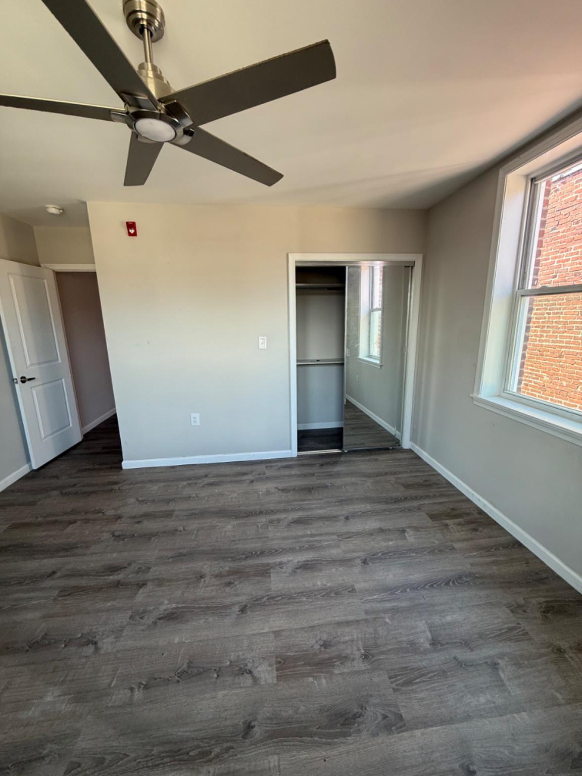 2013 North 63rd Street Philadelphia, PA 19151 - Photo 9 of 13 a view of empty room with wooden floor and fan
