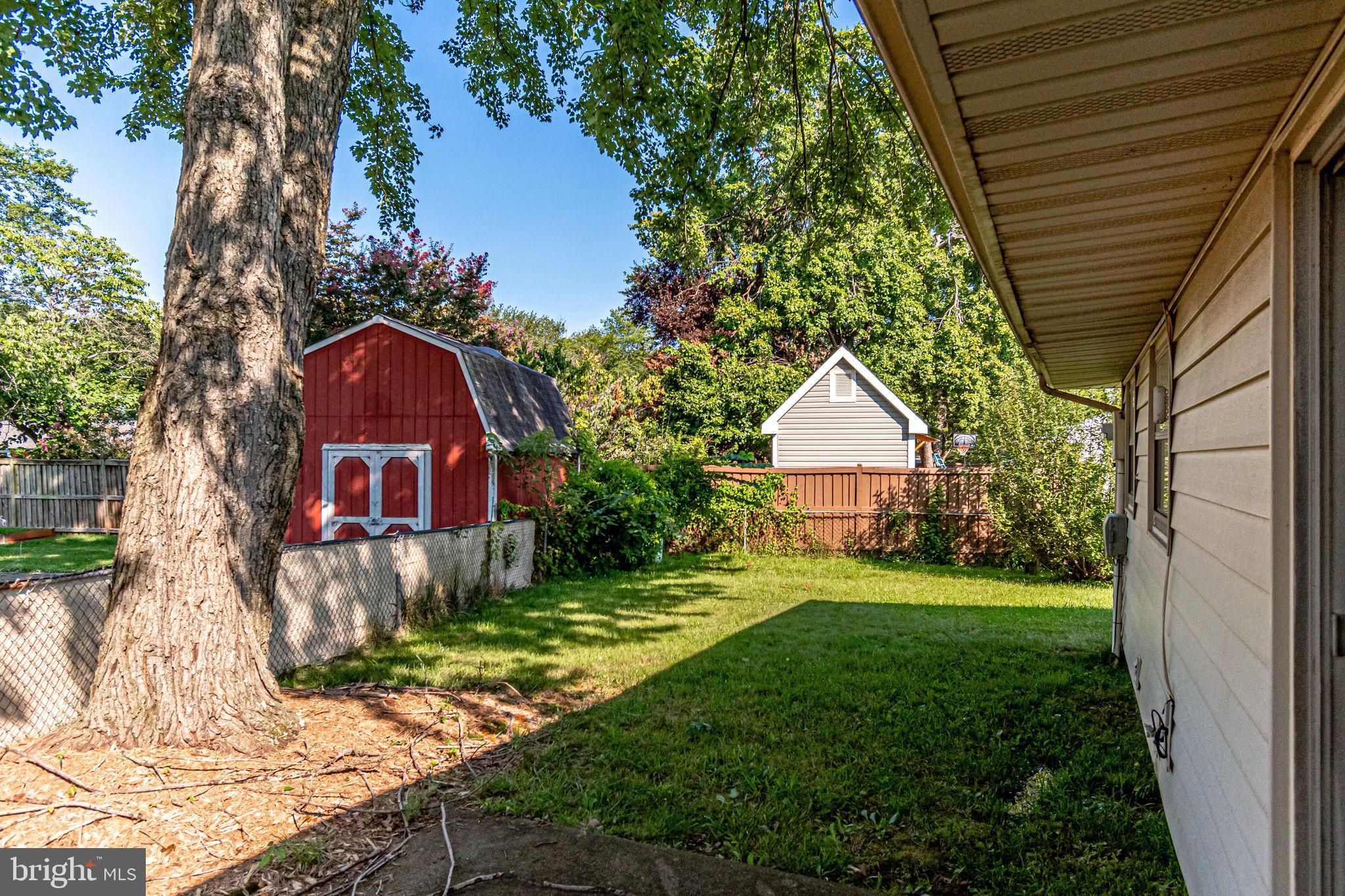 701 West Nettle Tree Road Sterling, VA 20164 - Photo 2 of 32 Fenced backyard with mature trees