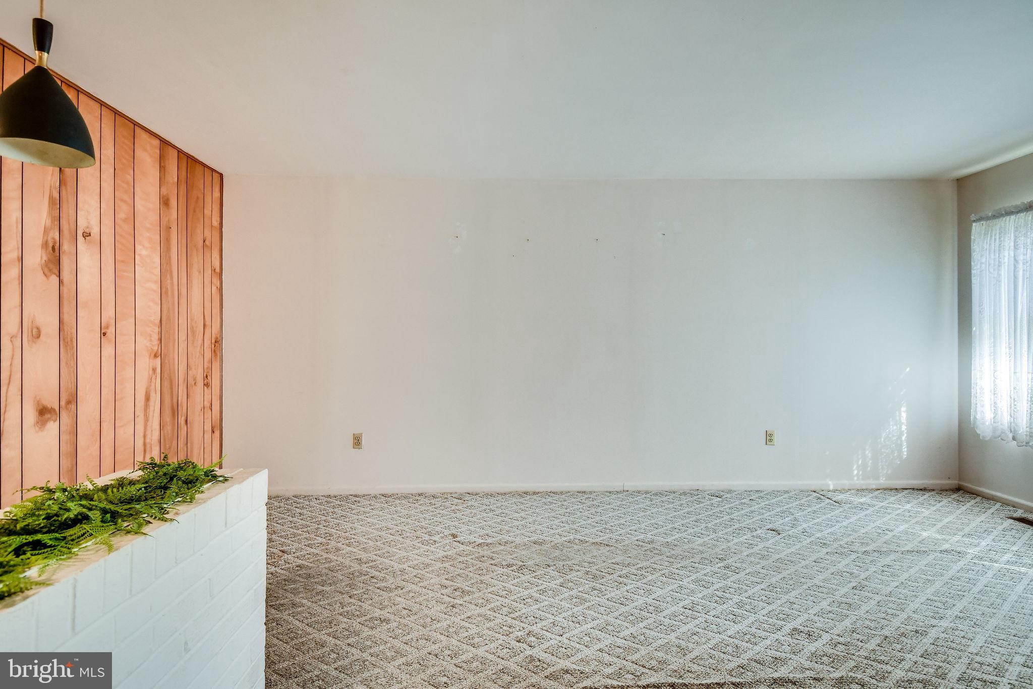 701 West Nettle Tree Road Sterling, VA 20164 - Photo 6 of 32 Paneled wall separates living room and kitchen