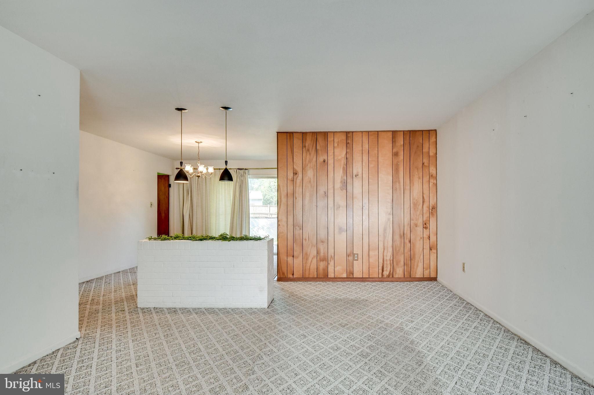 701 West Nettle Tree Road Sterling, VA 20164 - Photo 7 of 32 Planter divides the living and dining room
