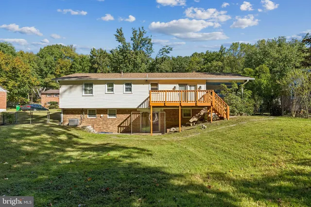 a view of a backyard with a sitting area
