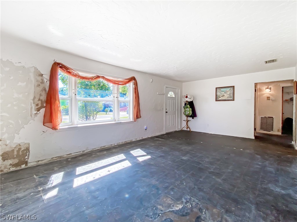 1573 Ransom Street Fort Myers, FL 33901 - Photo 5 of 29 a view of a livingroom with an empty space and a window