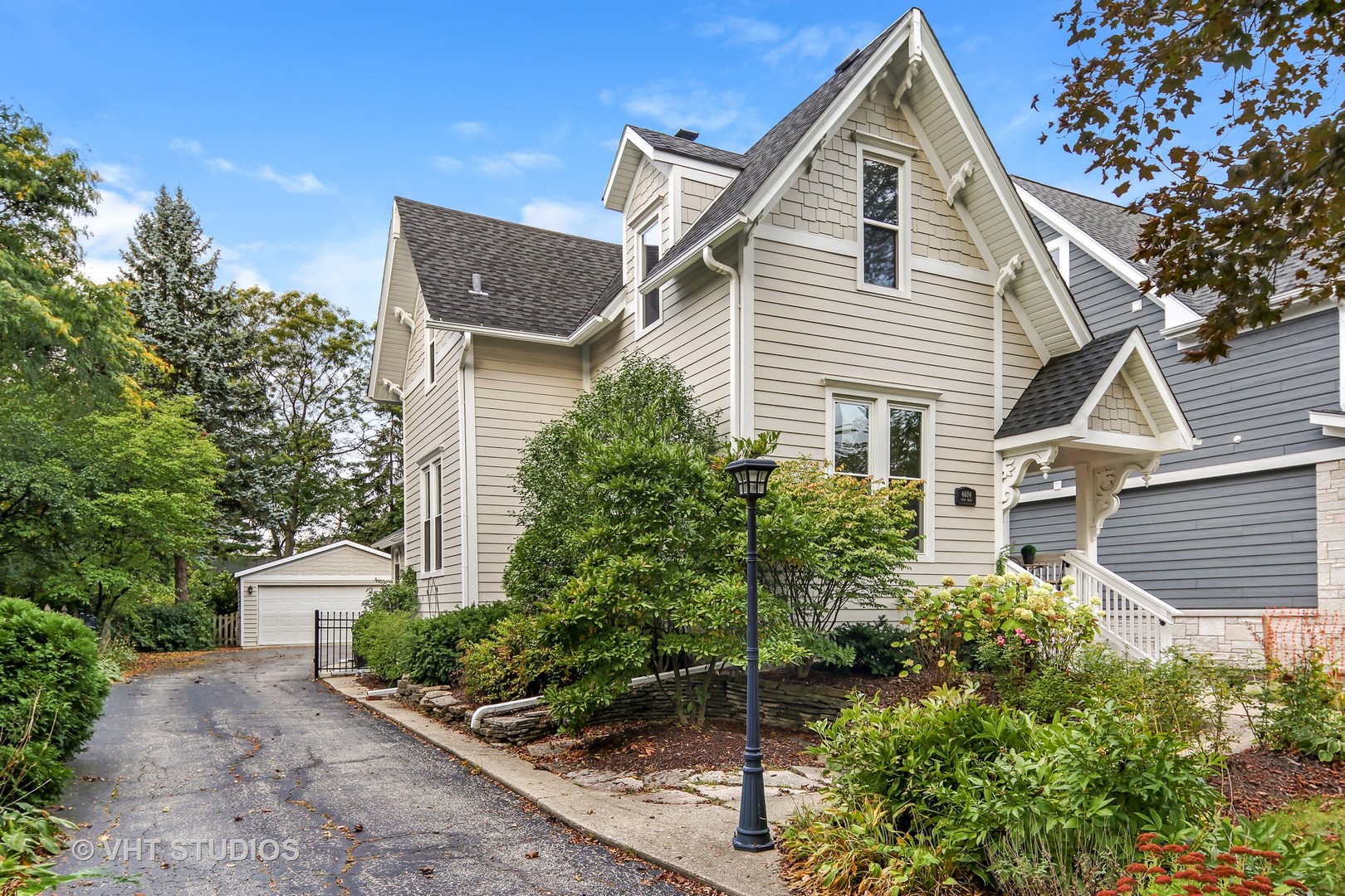 4604 Wolf Road Western Springs, IL 60558 - Photo 1 of 28 a view of a white house next to a yard