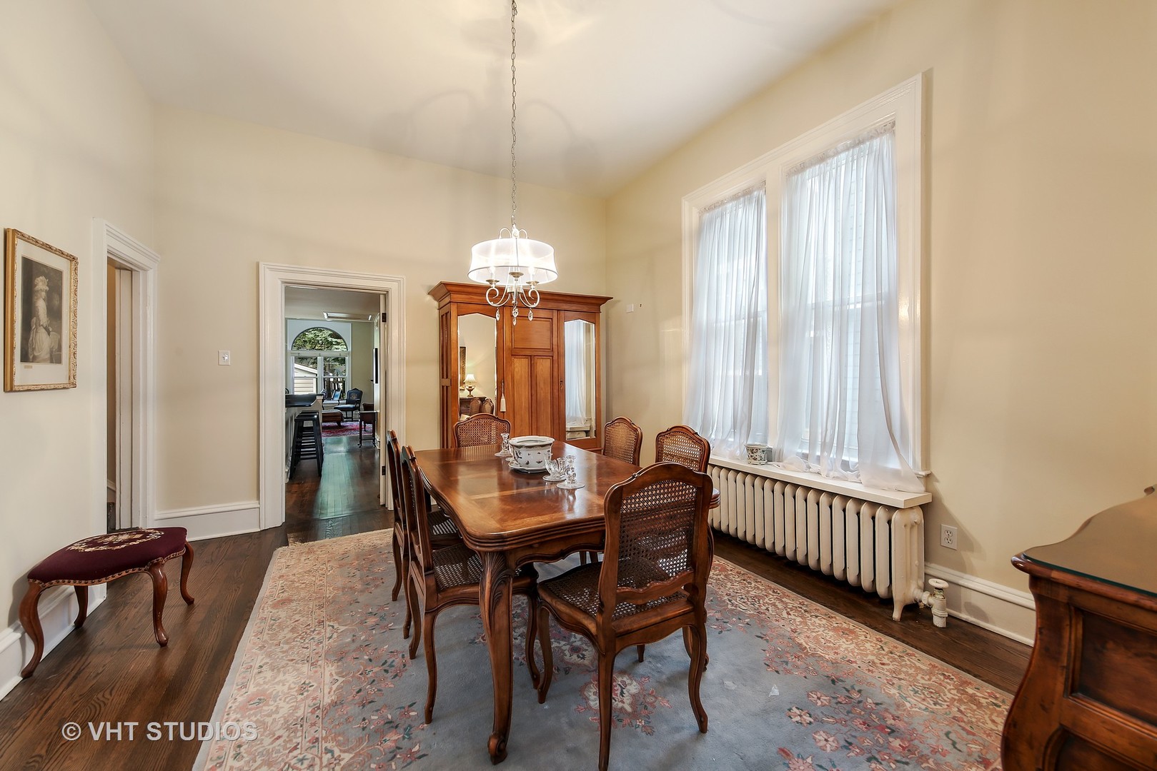 4604 Wolf Road Western Springs, IL 60558 - Photo 11 of 28 a dining room with furniture a chandelier and wooden floor