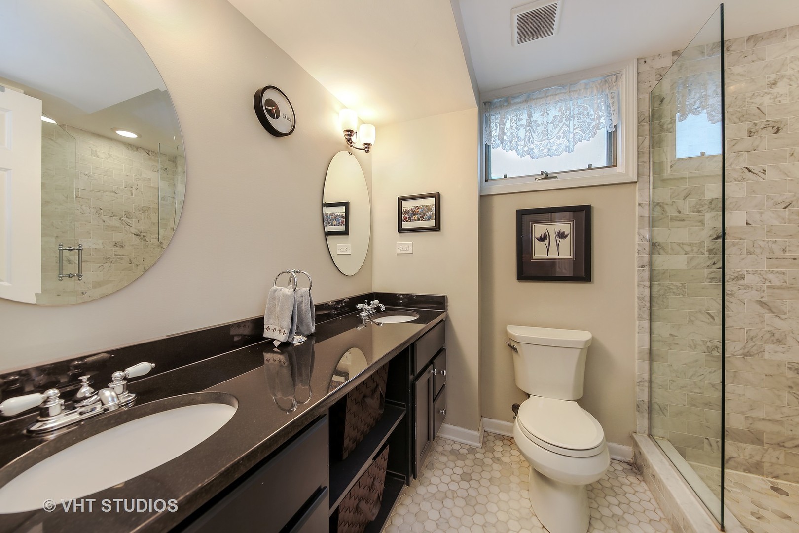 4604 Wolf Road Western Springs, IL 60558 - Photo 18 of 28 a bathroom with a toilet sink and mirror