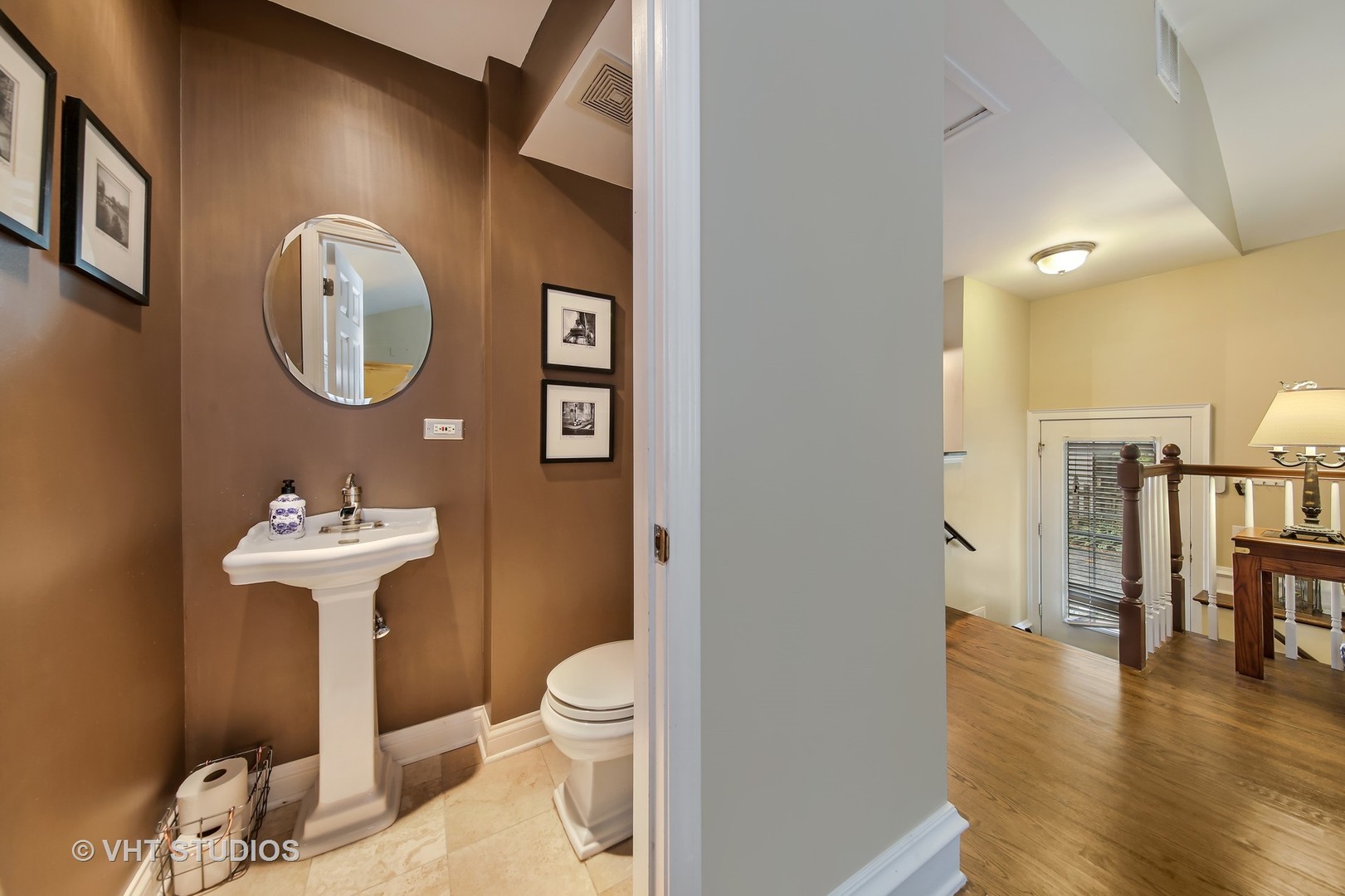4604 Wolf Road Western Springs, IL 60558 - Photo 20 of 28 a bathroom with a toilet a sink and a mirror