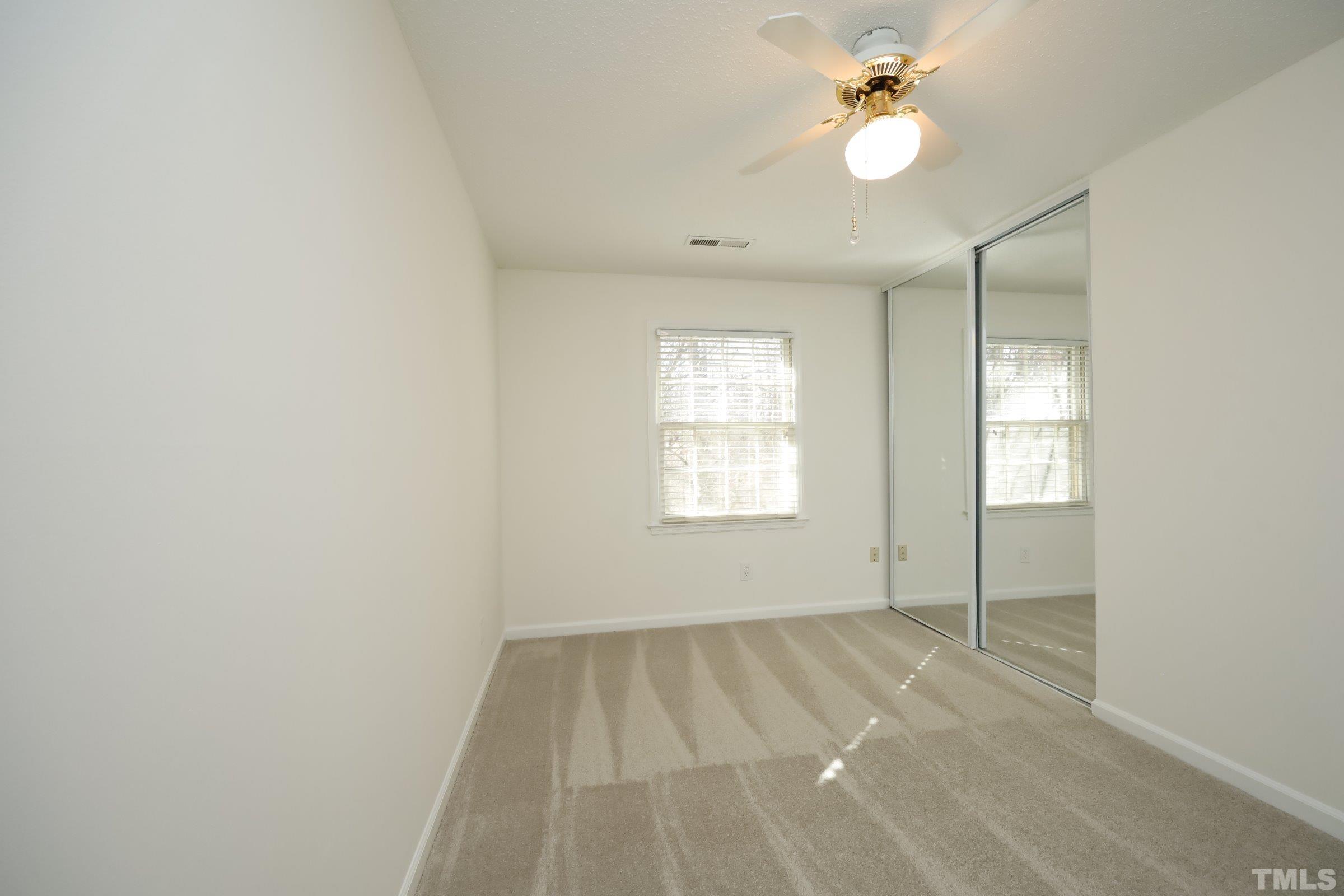 2838 Wycliff Road Raleigh, NC 27607 - Photo 22 of 39 wooden floor in an empty room with a window