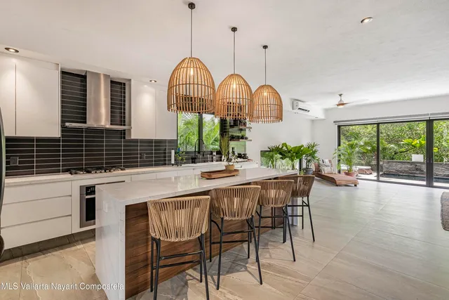 a view of a kitchen and a large window