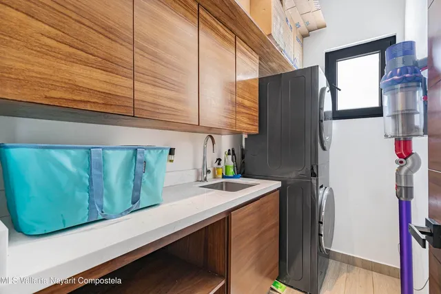 a kitchen with a sink and a refrigerator