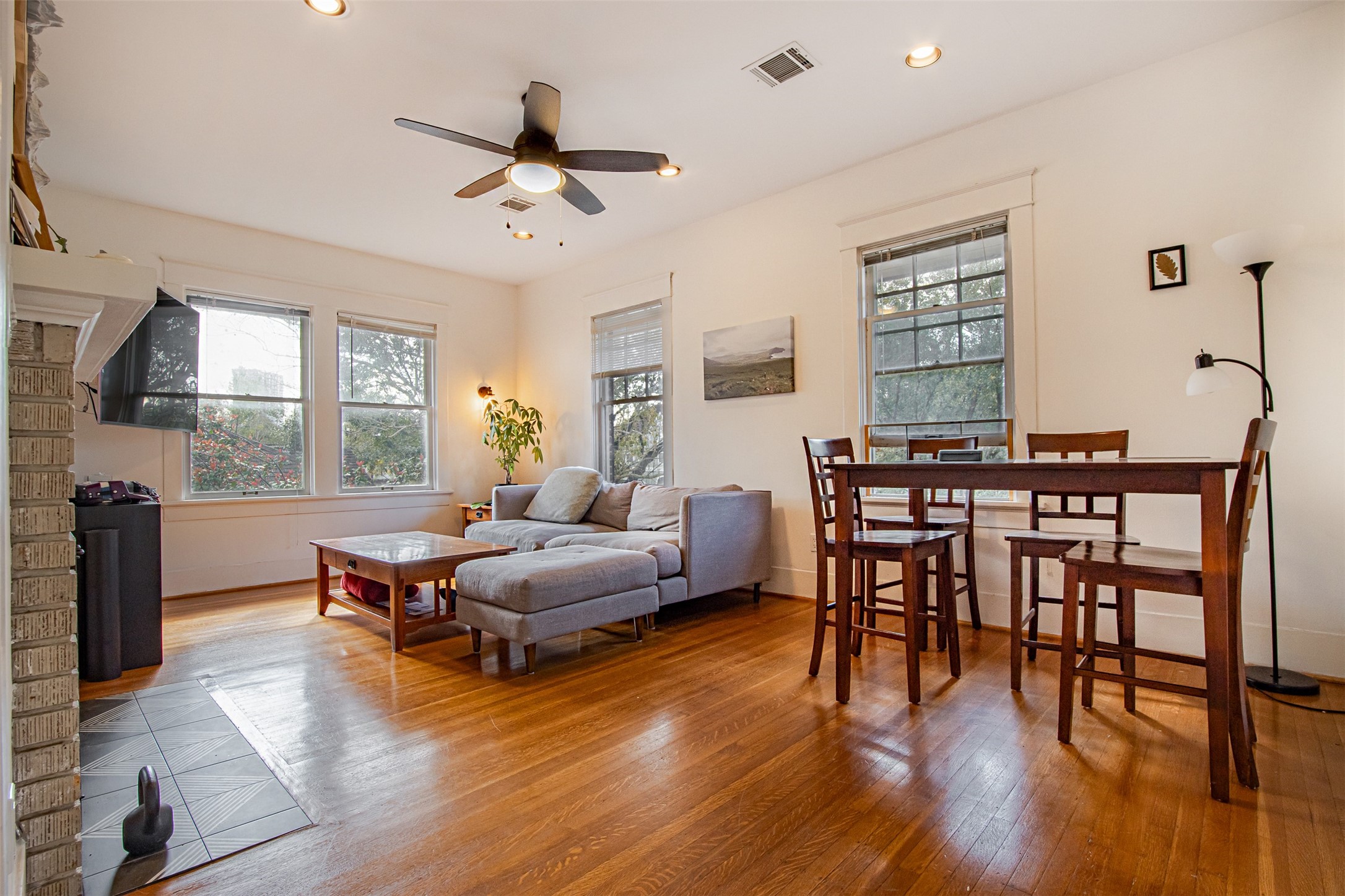 528 Hawthorne Street Houston, TX 77006 - Photo 12 of 34 a living room with furniture and wooden floor