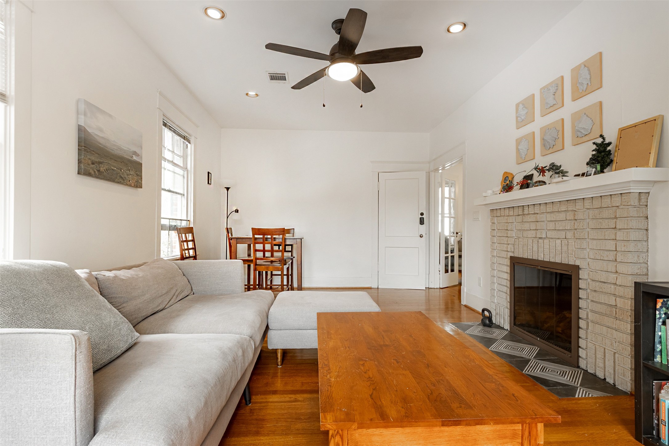 528 Hawthorne Street Houston, TX 77006 - Photo 14 of 34 a bedroom with furniture and a fireplace