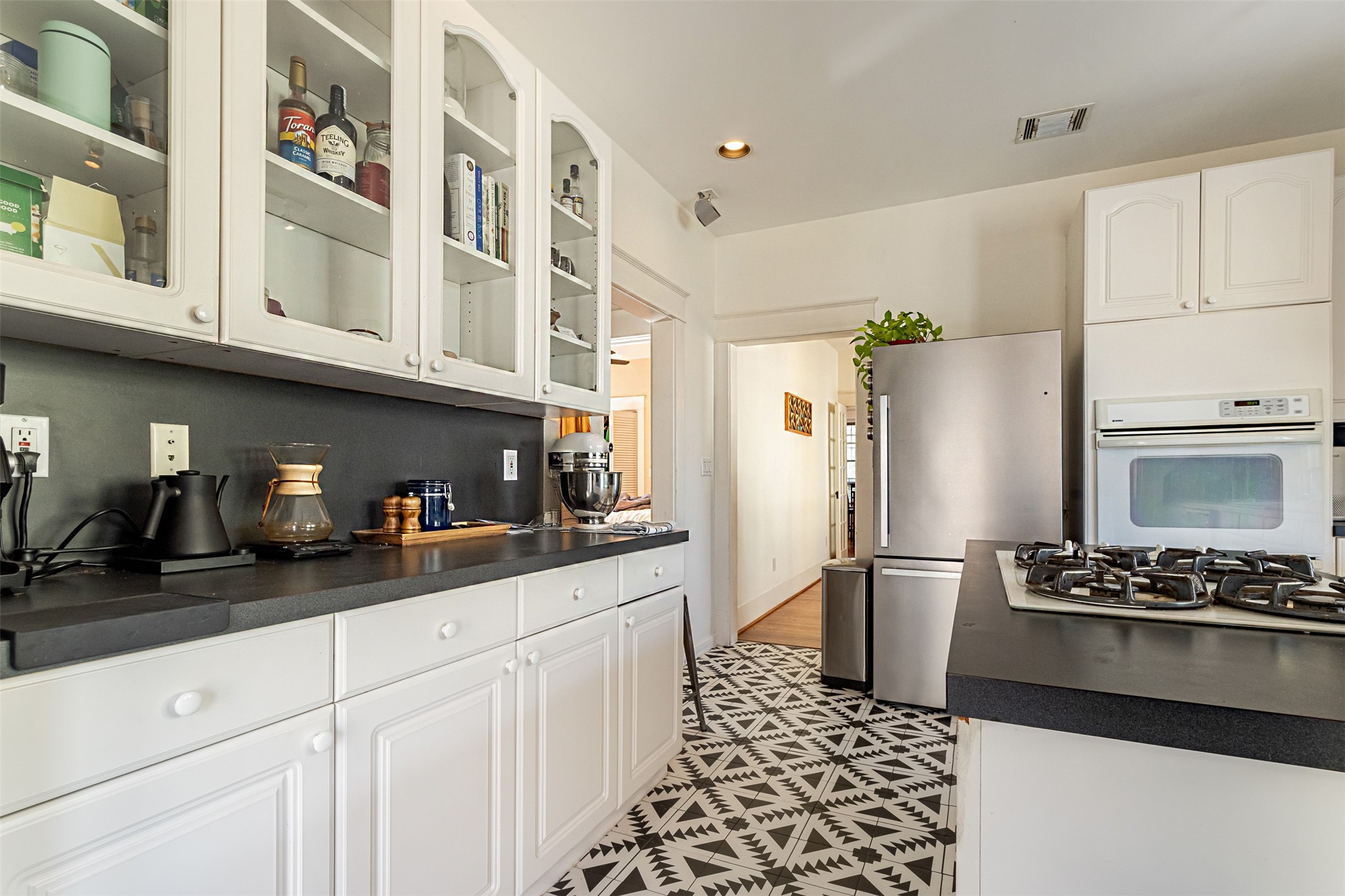 528 Hawthorne Street Houston, TX 77006 - Photo 18 of 34 a kitchen with stainless steel appliances a refrigerator and cabinets